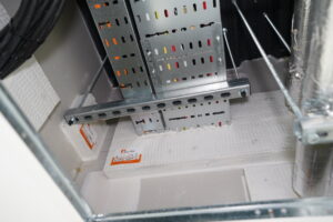 Compliant service penetration sealed with passive fire protection services